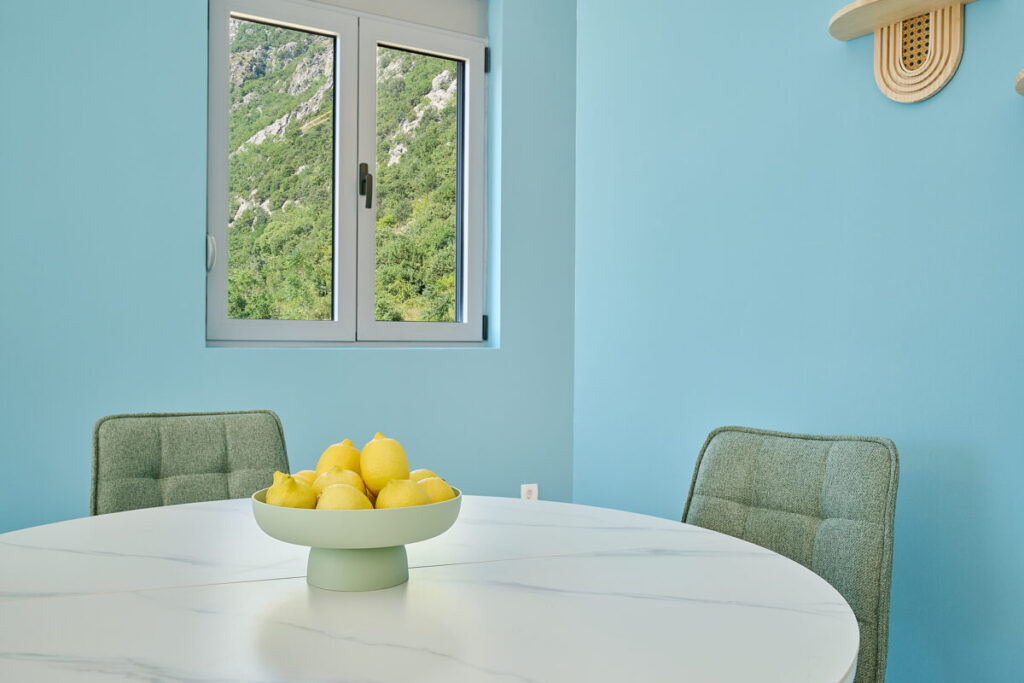 Dining table with lemons and window background - 2montenegro.me