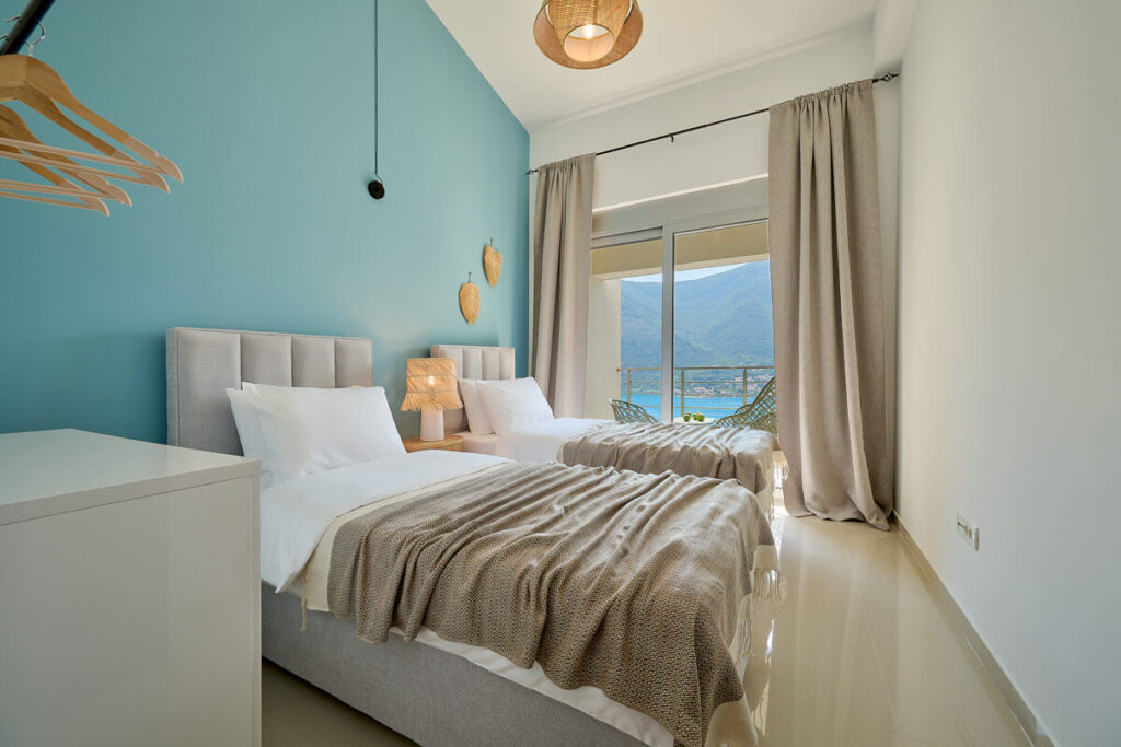 two single beds in the bedroom with sea view and full blackout curtains - 2montenegro.me